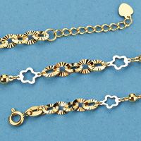 18K PULSERA BICOLOR FLORES. 3.10 GRS.